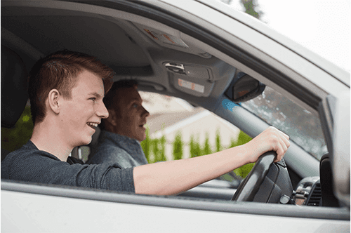Young learner driver with qualified passenger